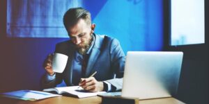 20160602195129-businessman-writing-planning-working-strategy-office-focus-formal-workplace-message